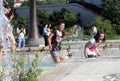 Kids play in a water of a fountain on a sunny summer day during summer break in Sofia, Bulgaria Ã¢â¬â june 15, 2012. Sunny weather c Royalty Free Stock Photo